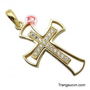 Trên nền thánh giá nhỏ hơn, những viên đá quý lấp lánh được sắp xếp cẩn thận, tượng trưng cho ánh sáng soi đường và lòng từ bi của Thiên Chúa.