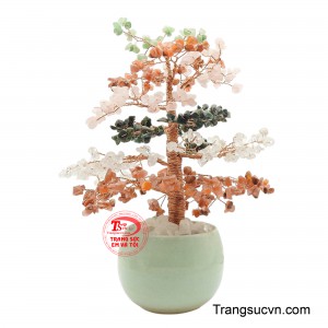 Các tán cây mang sắc trắng trong trẻo, xanh tươi, cam ấm áp và hồng đào, tạo nên tổng thể rực rỡ nhưng vẫn thanh lịch.