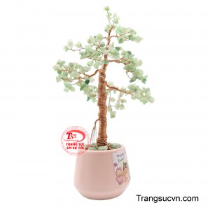 Các viên đá Aventurine xanh nhạt, được đánh bóng, gắn kết khéo léo để tạo thành một tán lá xanh tươi, lấp lánh nhẹ. 